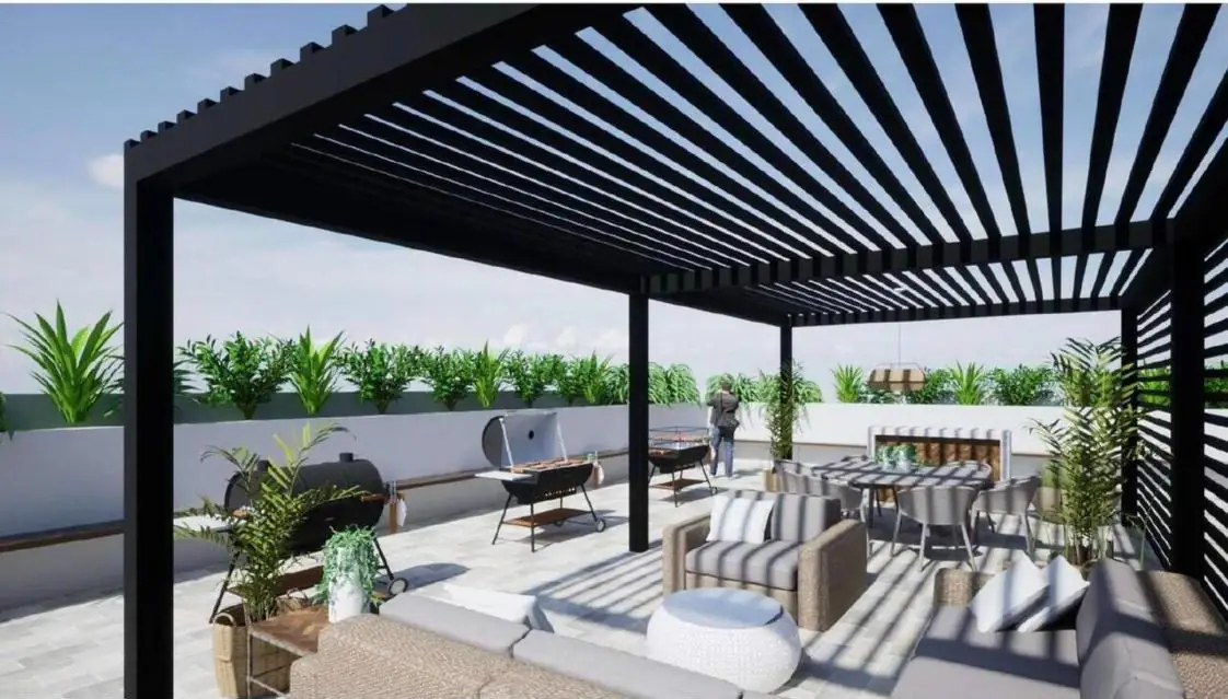 Rooftop com pergolado, lounge, churrasqueiras e mesa de jantar